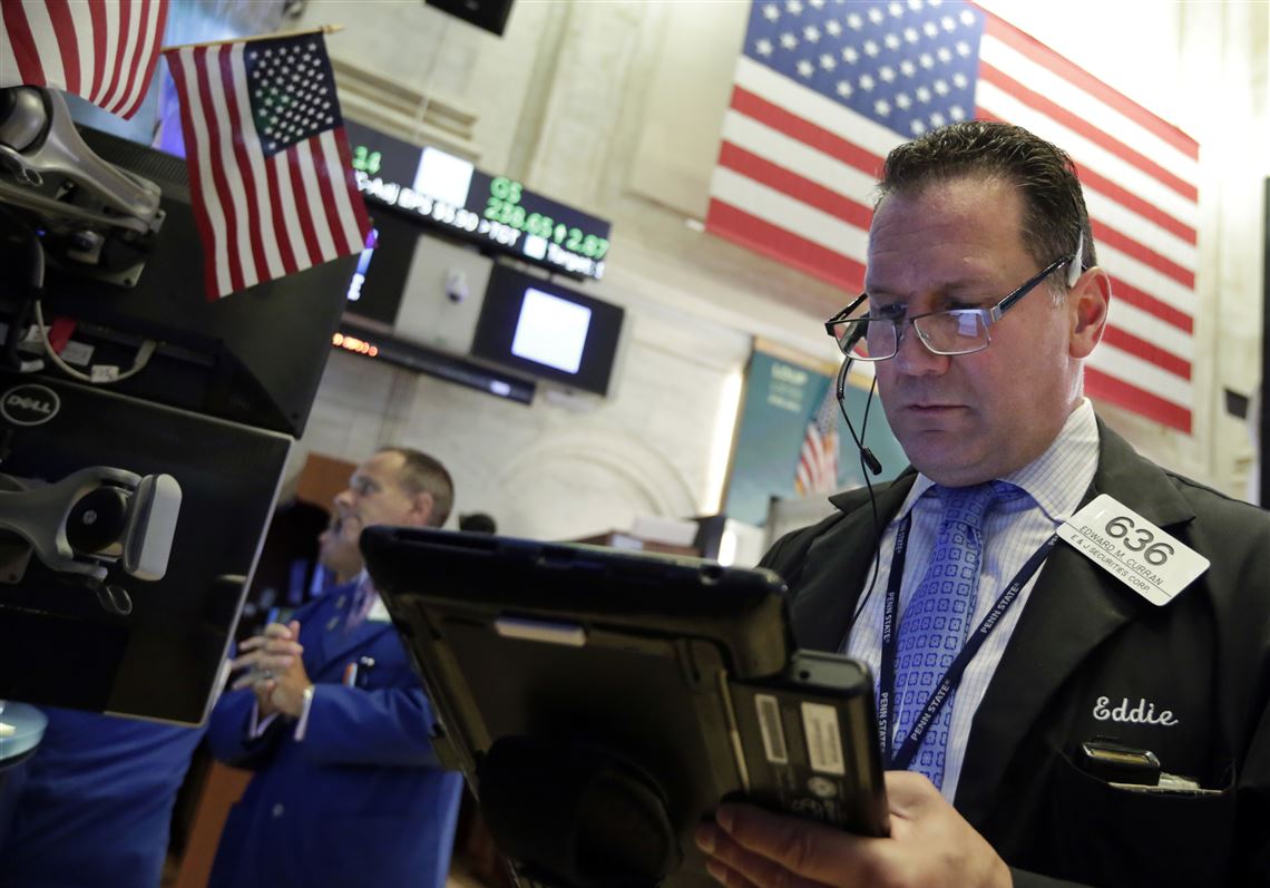 Trader Edward Curran works on the floor of the New York Stock Exchange, Wednesday, Aug. 22, 2018. Stocks are off to a mixed start on Wall Street as the U.S. market is poised to reach its longest-ever bull run. (AP Photo/Richard Drew)