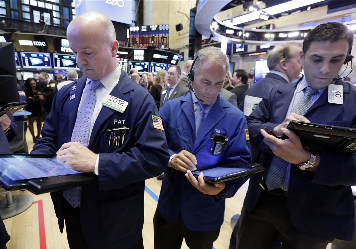 Traders work on the floor of the New York Stock Exchange, Tuesday, March 7, 2017. Stocks are opening broadly lower on Wall Street, led by declines in health care stocks and banks. (AP Photo/Richard Drew)