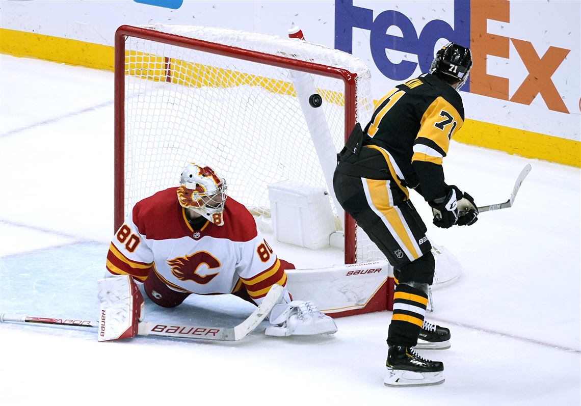Malkin, Penguins surge past Flames with 5 goals in the third period for a  5-2 win