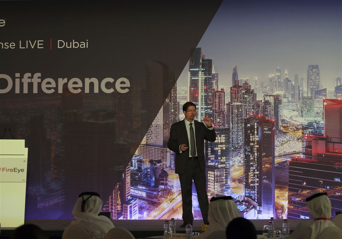 Tony Cole, Vice President of FireEye Inc., a cybersecurity firm headquartered in Milpitas, California, speaks at the FireEye Cyber Defence Live conference, Tuesday, Sept. 12, 2017, in Dubai, United Arab Emirates. State-sponsored hacks have become an increasing worry among countries across the Persian Gulf. They include suspected Iranian cyberattacks on Saudi Arabia to leaked emails causing consternation among nominally allied Arab nations. (AP Photo/Kamran Jebreili)