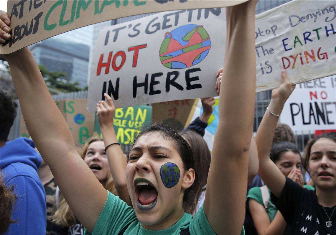 Hundreds of schoolchildren take part in a climate protest in Hong Kong, Friday, March 15, 2019. 
