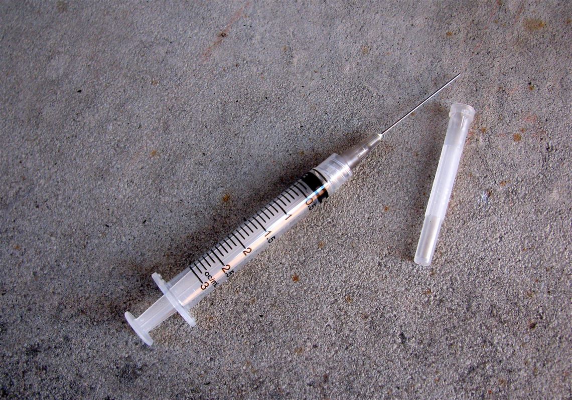 Police: "Missing" child found among heroin bundles