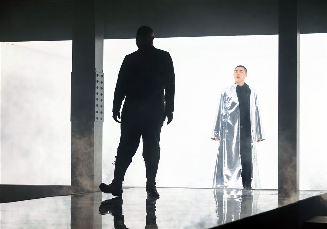 The outlaw (Yazid Gray) and the medium (Chuanyuan Liu) in the Pittsburgh Opera production of "In a Grove."