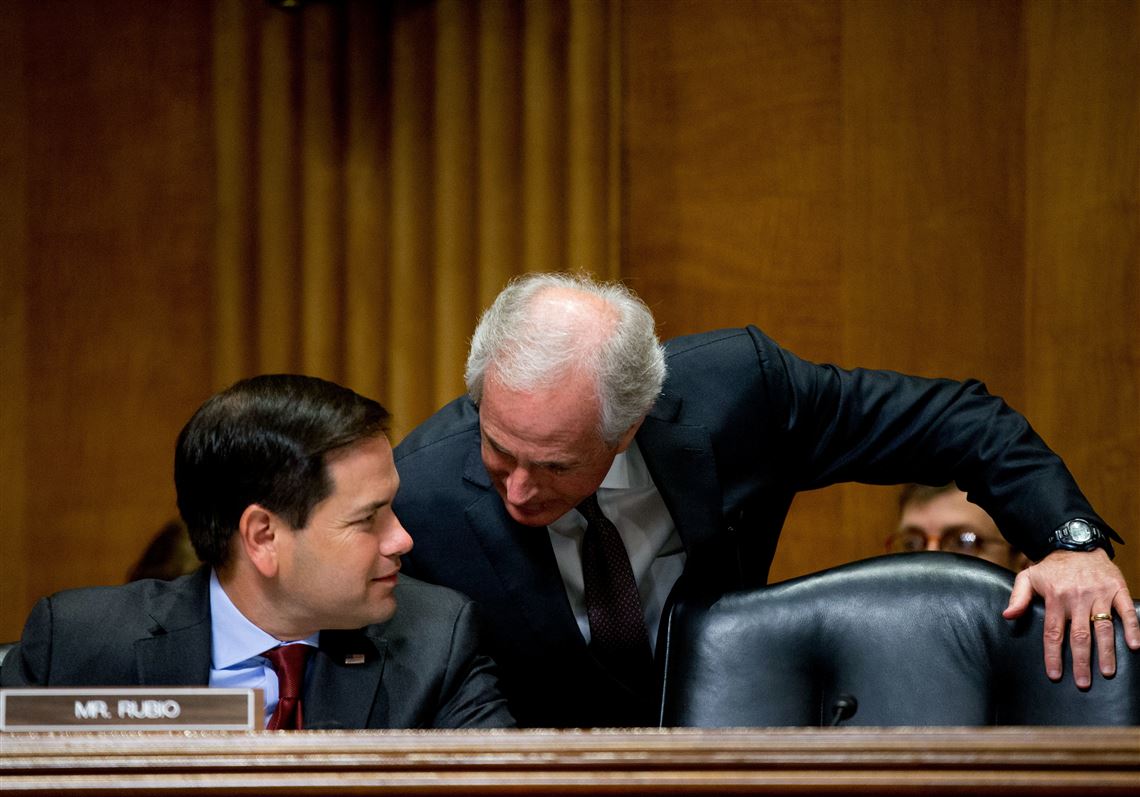 Senate Foreign Relations Committee Chairman Bob Corker, R-Tenn., right, speaks with Sen. Marco Rubio, R-Fla., on Capitol Hill in Washington, Tuesday, April 5, 2016, during the committee's hearing  on recent Iranian actions and implementation of the nuclear deal. (AP Photo/Andrew Harnik)