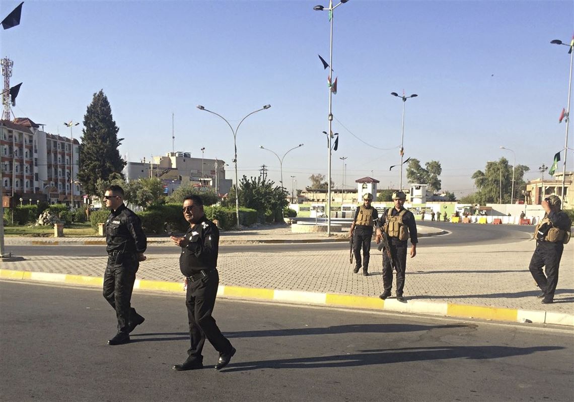 Local police are deployed in Kirkuk, 290 kilometers (180 miles) north of Baghdad, Iraq, Monday, Oct. 16, 2017.  Iraqi Kurdish officials said early Monday that federal forces and state-backed militias have launched a 