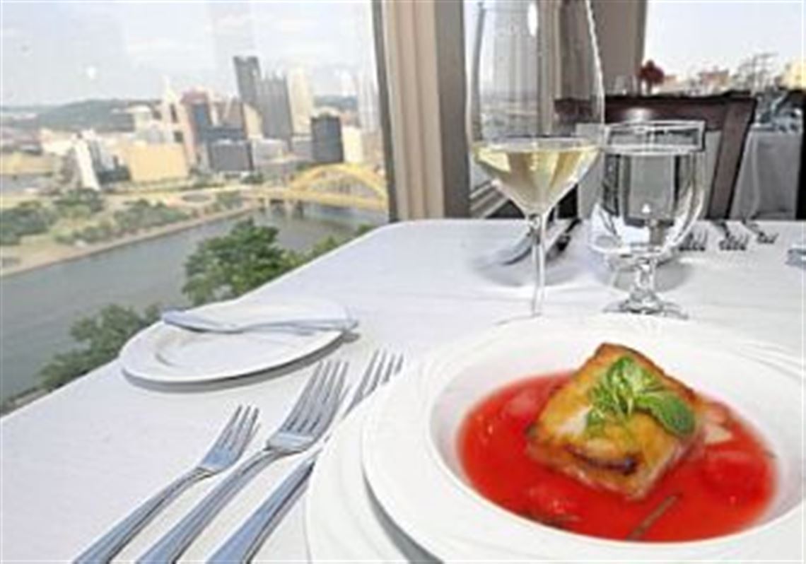 The view from Isabela on Grandview, atop Mount Washington, with a serving of honey-glazed blue marlin with fresh watermelon, pickled watermelon rind and a mint gastrique