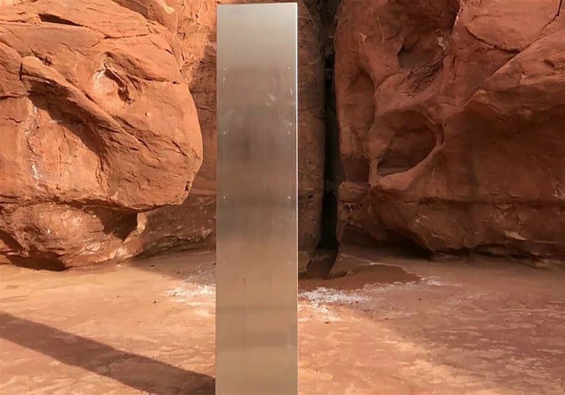 This photo provided by the Utah Department of Public Safety shows a metal monolith installed in the ground in a remote area of red rock in Utah. 