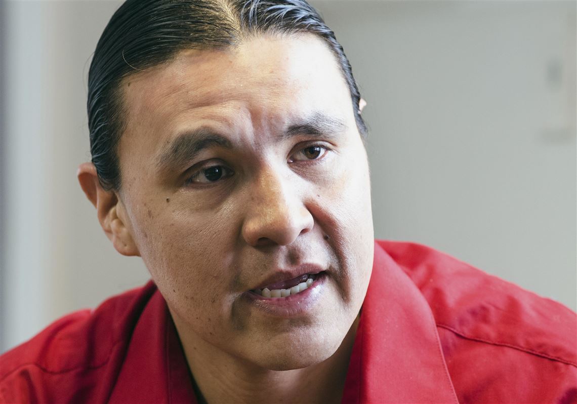 FILE - In this Feb. 6, 2014, file photo, Chase Iron Eyes, an attorney and American Indian activist on the Standing Rock Reservation, is seen in Fort Yates, N.D. Iron Eyes, who is accused of inciting a riot during protests against the Dakota Access pipeline says he'll seek to present a 