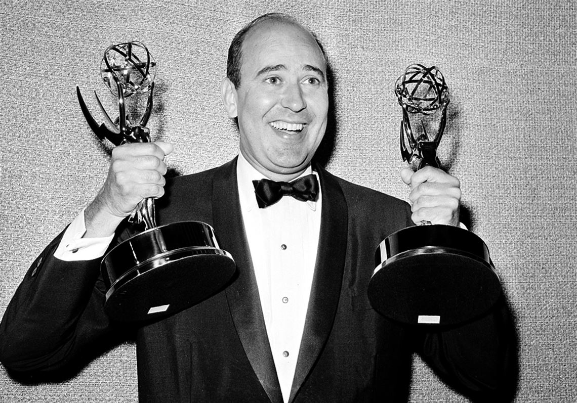 In this May 26, 1963 file photo, Carl Reiner holds two Emmy statuettes presented to him as best comedy writer for the 