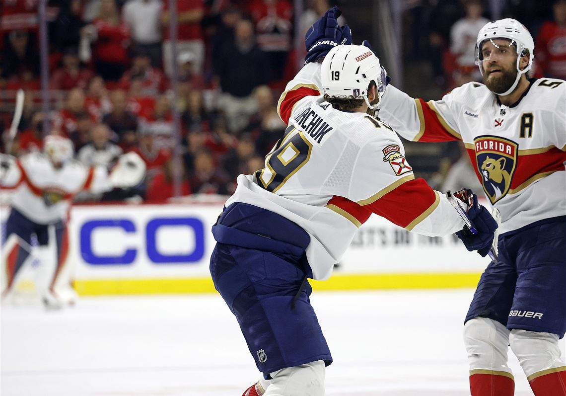 Florida Panthers' Matthew Tkachuk (19) celebrates his goal in the fourth overtime against the Carolina Hurricanes with with Aaron Ekblad (5) in Game 1 of the NHL hockey Stanley Cup Eastern Conference finals in Raleigh, N.C., early Friday, May 19, 2023.