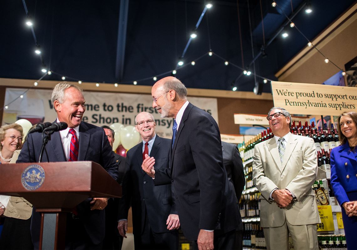 Mike Turzai, left, the state Speaker of the House, and Gov. Tom Wolf joke around during a press conference Thursday to introduce the sale of wine at Wegmans in Mechanicsburg, Pa.