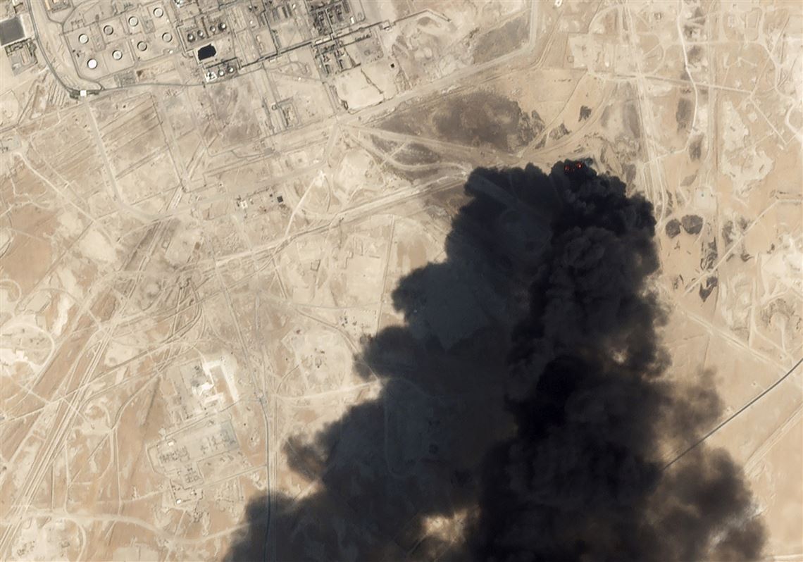 This Sept. 14, 2019, satellite image shows thick, black smoke rising from the Abqaiq oil processing facility in Buqyaq, Saudi Arabia.