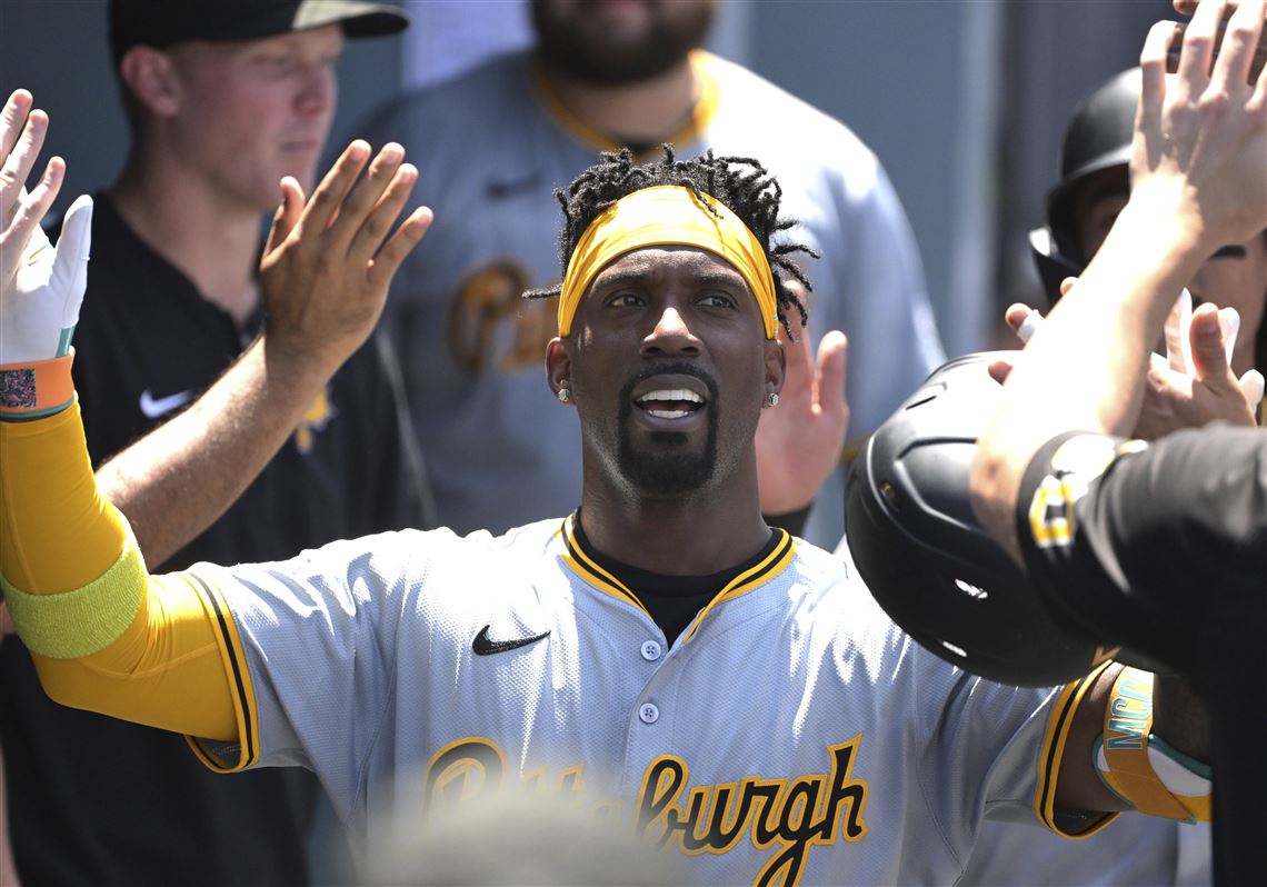Pittsburgh Pirates' Andrew McCutchen is congratulated in the dugout after hitting a two-run home run in the third inning of a baseball game against the Los Angeles Dodgers, Sunday, Aug. 11, 2024, in Los Angeles. (AP Photo/Jayne-Kamin-Oncea)