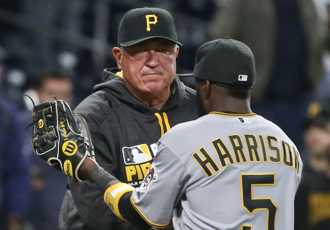 Pirates second baseman Josh Harrison is congratulated by manager Clint Hurdle after the Pirates' 11-1 victory over the Padres in April.