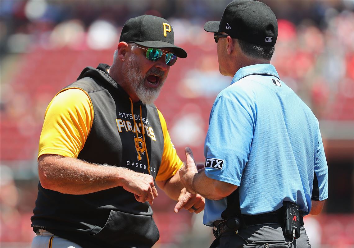 Pittsburgh Pirates' Daniel Vogelbach listens to home plate umpire