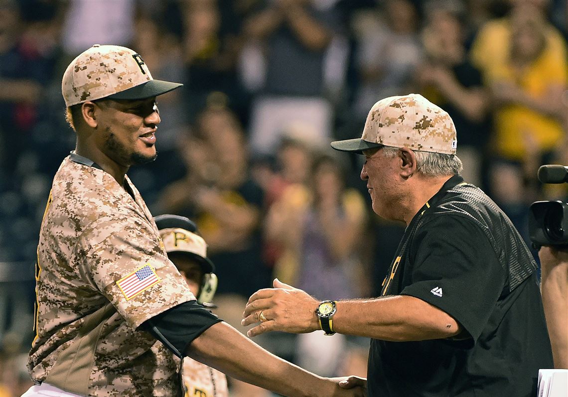 Ivan Nova is congratulated by manager Clint Hurdle on Thursday after his complete game victory against the Cincinnati Reds at PNC Park.