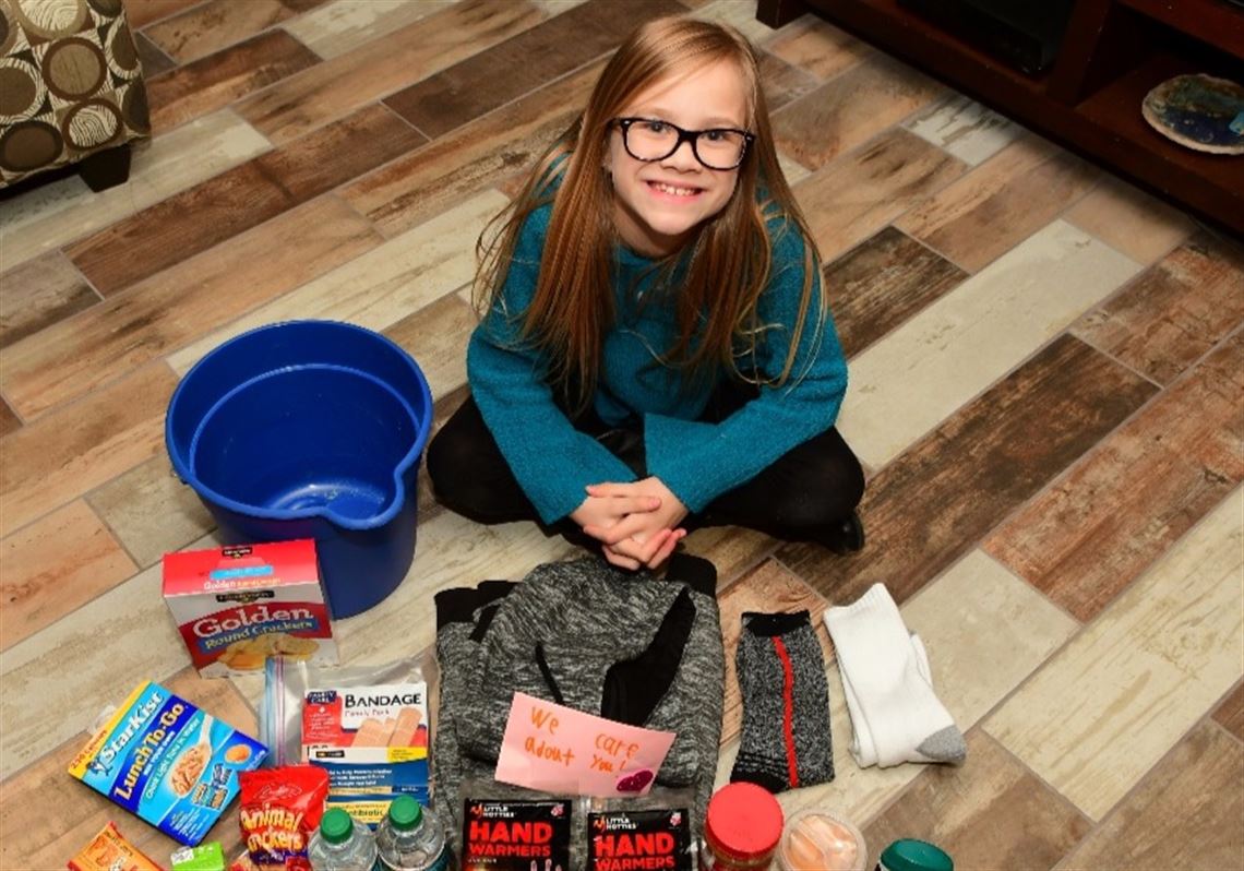 8-year-old leads 'bucket brigade' mission to supply, feed homeless in ...