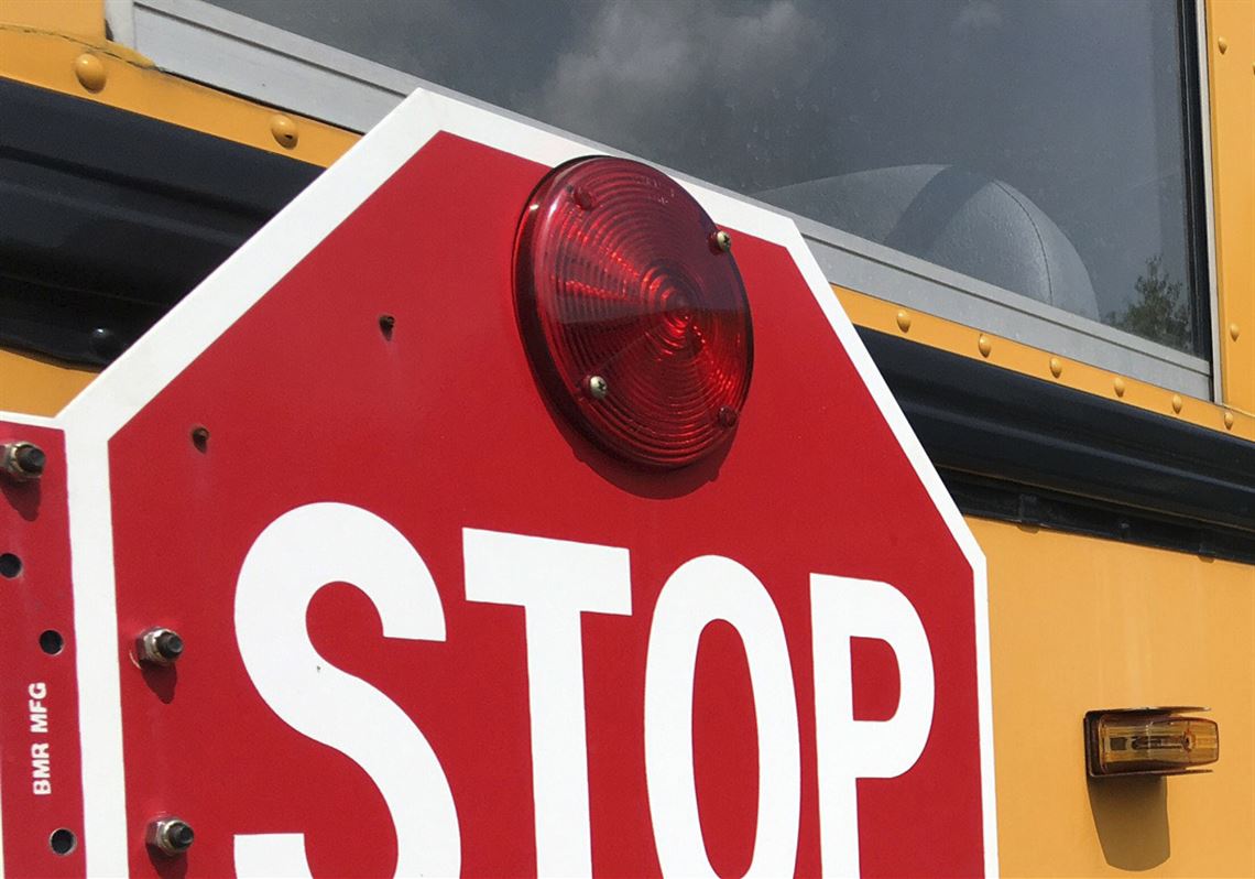 A stop sign on a school bus.