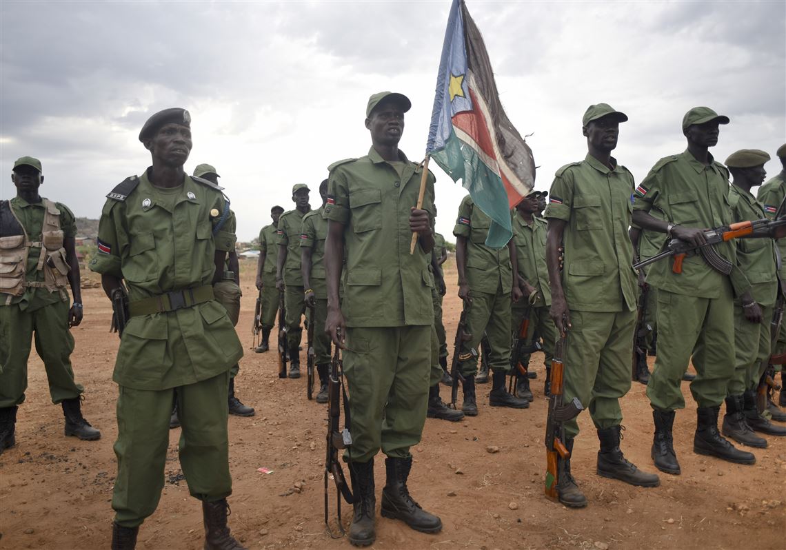 South Sudanese rebel soldiers stand to attention at a military camp in the capital Juba, South Sudan, April 7.