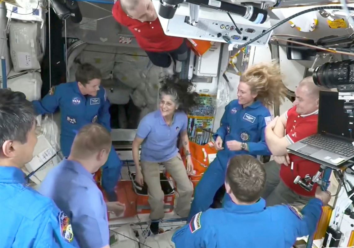 NASA’s stuck astronauts welcome their newly arrived replacements to the space station