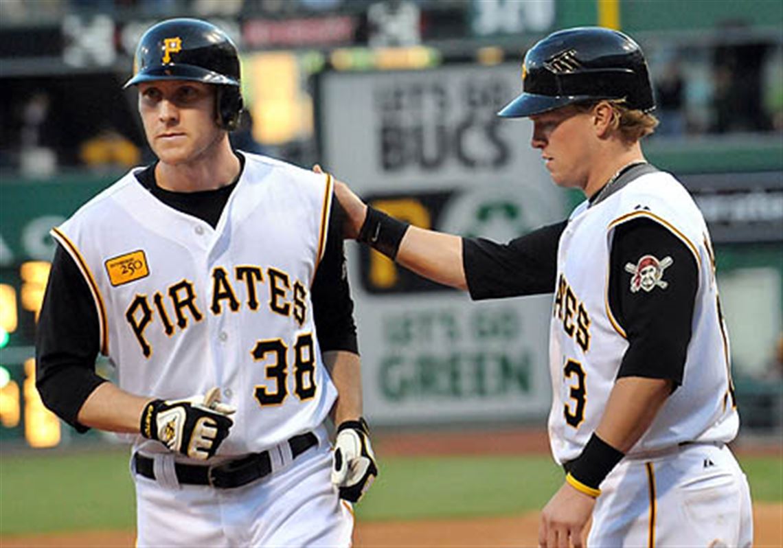 Pittsburgh Pirates' Jason Bay, left, knocks the ball loose from