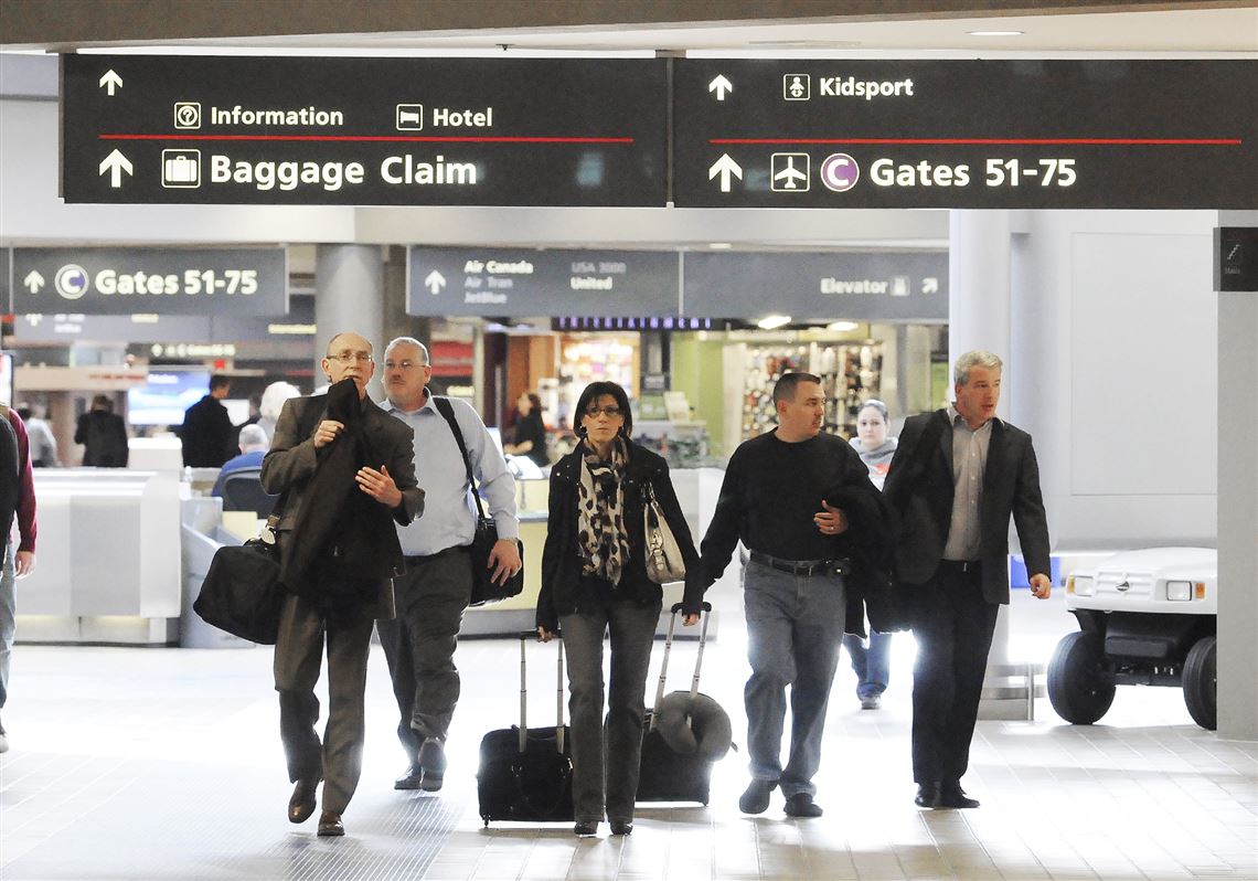 Travelers head to their terminal at the Pittsburgh International Airport.The airport will be off the grid by the summer of 2021 thanks to a private-public partnership with Peoples Natural Gas.