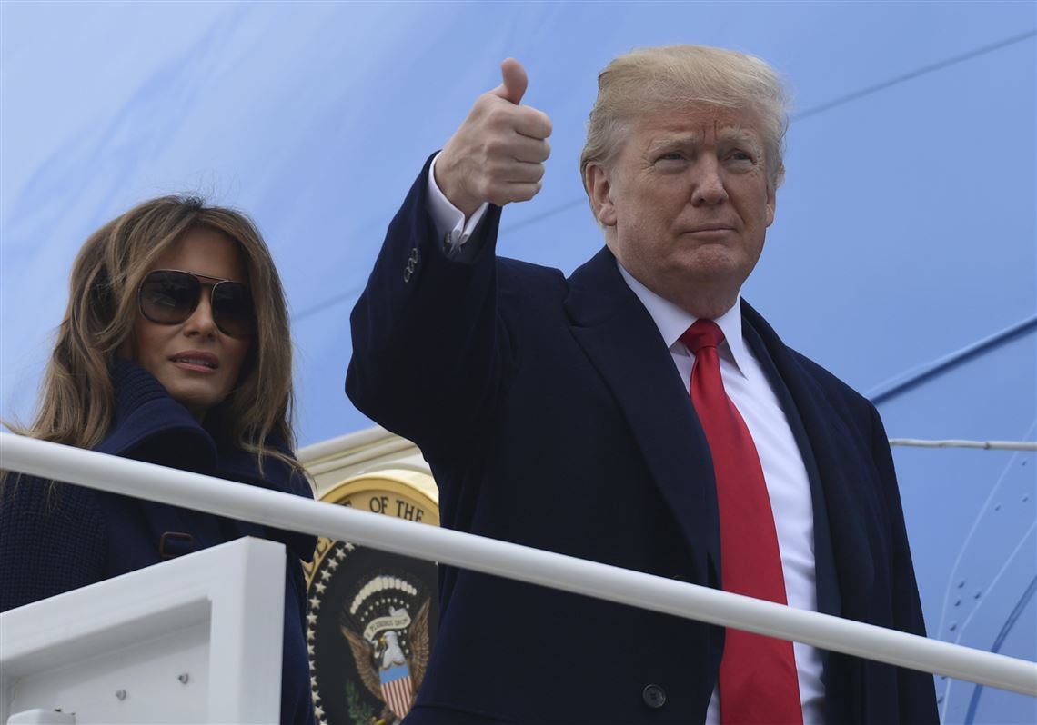 President Donald Trump and first lady Melania Trump board Air Force One at Andrews Air Force Base in Maryland on March 19, 2018.