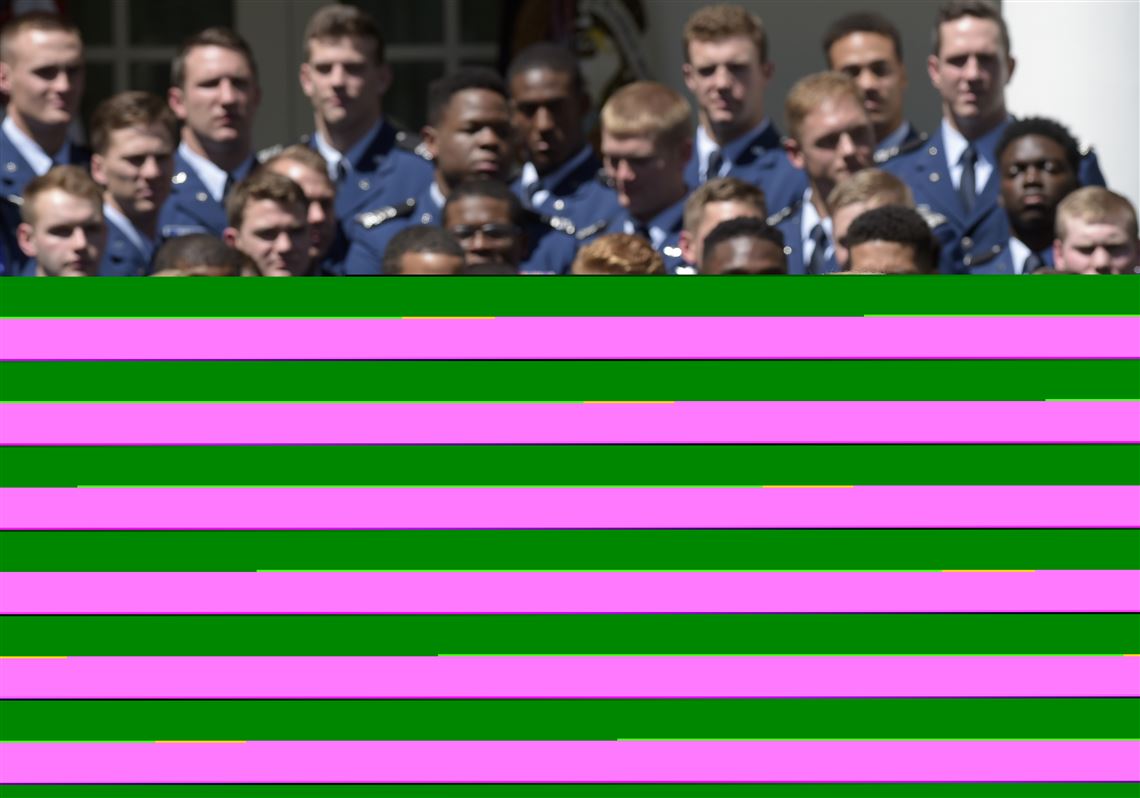 Air Force Academy Superintendent Lt. Gen. Michelle Johnson, left, and football team members, listens as President Donald Trump speaks in the Rose Garden of the White House in Washington, Tuesday, May 2, 2017, during a presentation ceremony of the Commander-in-Chief trophy to the Air Force Academy football team. (AP Photo/Susan Walsh)