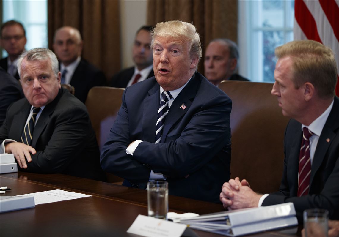 President Donald Trump speaks during a cabinet meeting at the White House, Wednesday, May 9, 2018, in Washington. From left, Deputy Secretary of State John Sullivan, Trump, and Deputy Secretary of Defense Patrick Shanahan. (AP Photo/Evan Vucci)