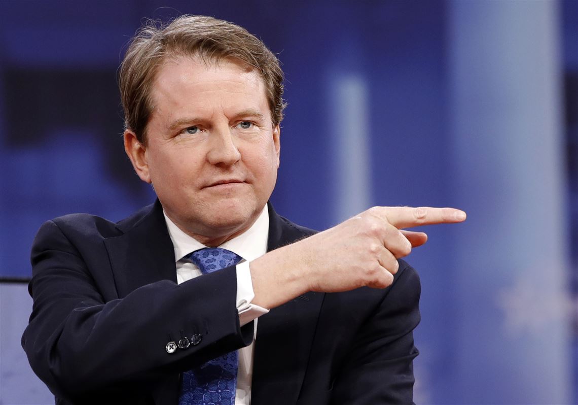 FILE - In this Feb. 22, 2018, file photo, White House counsel Don McGahn gestures while speaking at the Conservative Political Action Conference (CPAC), at National Harbor, Md. As a candidate, Donald Trump pledged to drain the swamp in Washington. But as president, records show he and his appointees have stocked federal agencies with ex-lobbyists and corporate lawyers who now help regulate they very industries rom which they collected paychecks. Records reviewed by The Associated Press show McGahn, has issued at least 24 ethics waivers to key administration officials at the White House and executive branch agencies. (AP Photo/Jacquelyn Martin, File)