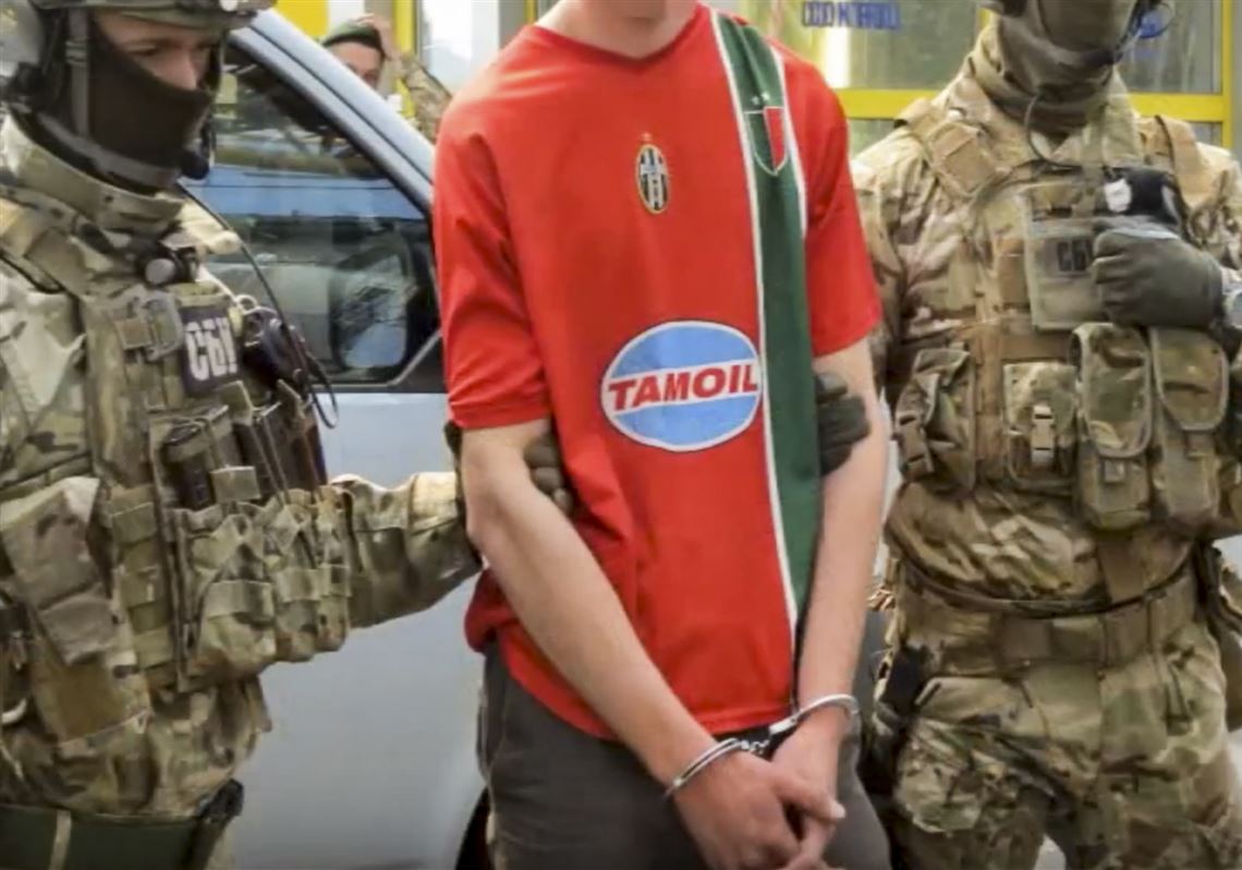 In this image, provided by the Ukrainian Intelligence Agency SBU on Monday, SBU agents detain a suspect at the Yahodyn border crossing on the Ukrainian-Polish border, Ukraine.