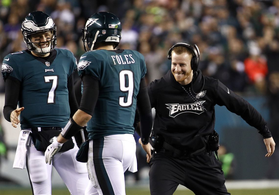 Eagles quarterback NICK FOLES passes downfield