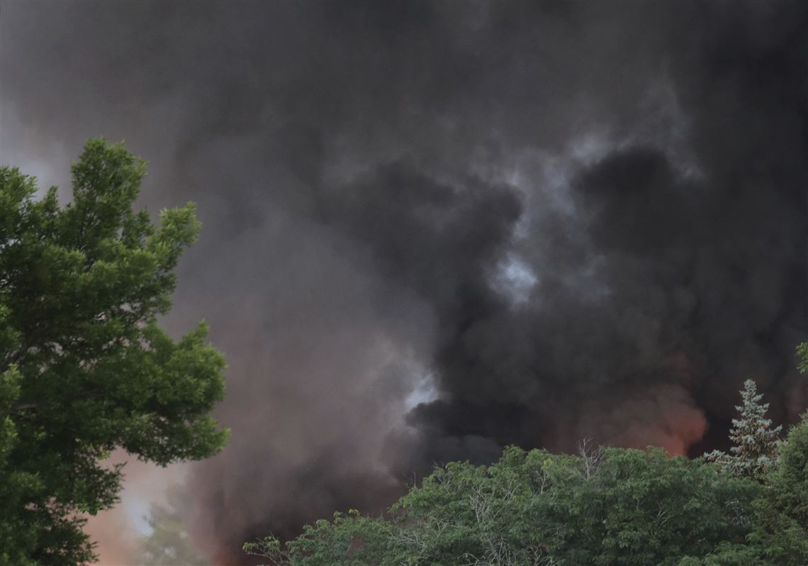 Smoke rises as firefighters work the scene of an explosion in downtown Sun Prairie, Wis., Tuesday, July 10, 2018. The explosion rocked the downtown area of Sun Prairie, a suburb of Madison, after a contractor struck a natural gas main. 