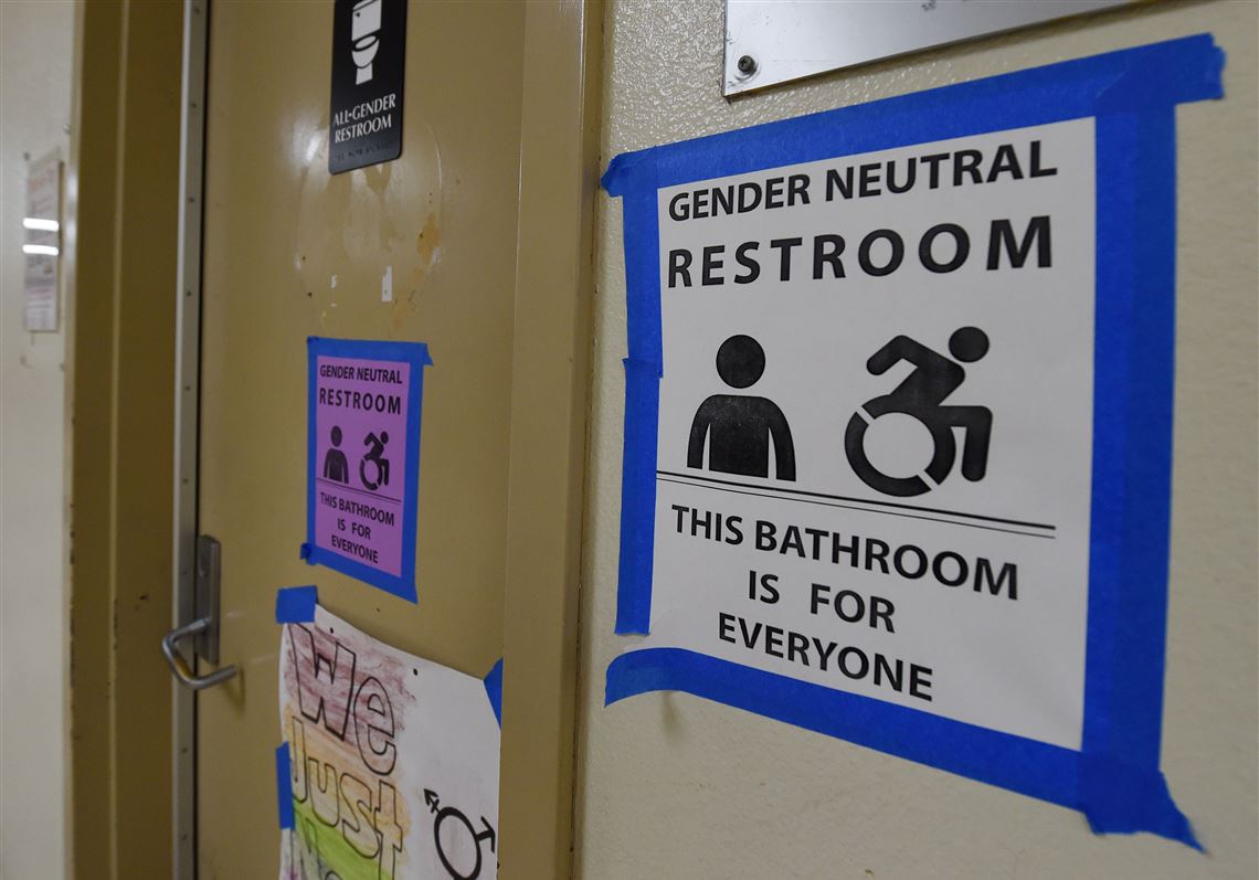 Signs are poseted outside the Santee High School's gender neutral restrooms at their campus in Los Angeles, California on May 4, 2016.
