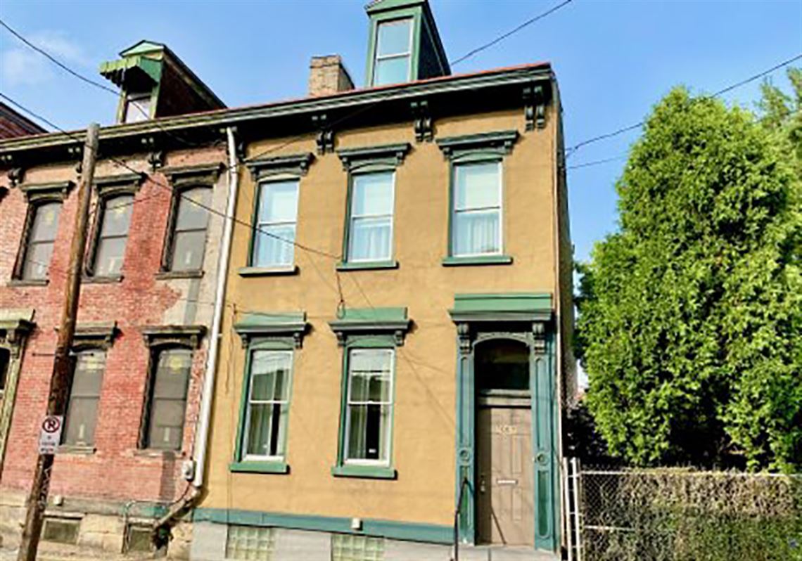 Buying Here 1880 North Side row house with original woodwork priced