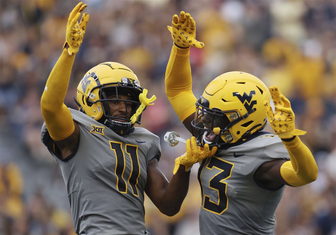 West Virginia football dominates Duquesne after long weather delay