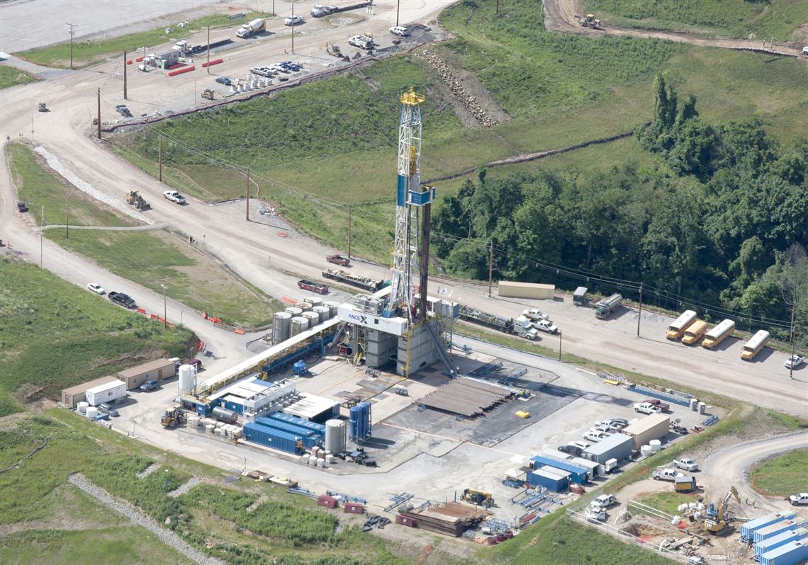 In this June 25, 2012 file photo, a crew works on a drilling rig at a well site for shale-based natural gas in Zelienople. The oil and gas drilling method used is known as hydraulic fracturing, or 