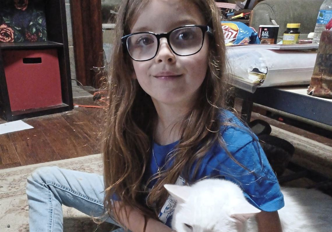  Ivy Larson and her cat, Steve, who died at age 16.