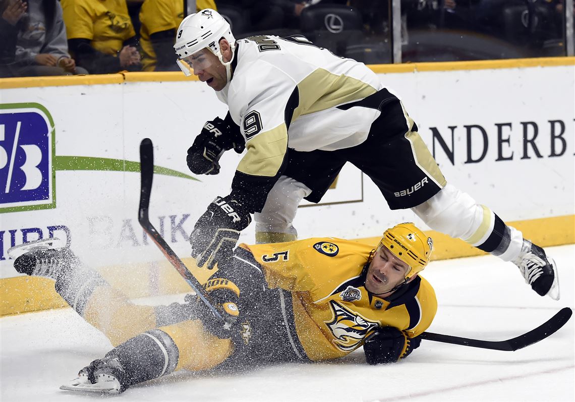 Pascal Dupuis collides with Predators defenseman Barret Jackman in the first period Saturday in Nashville, Tenn.