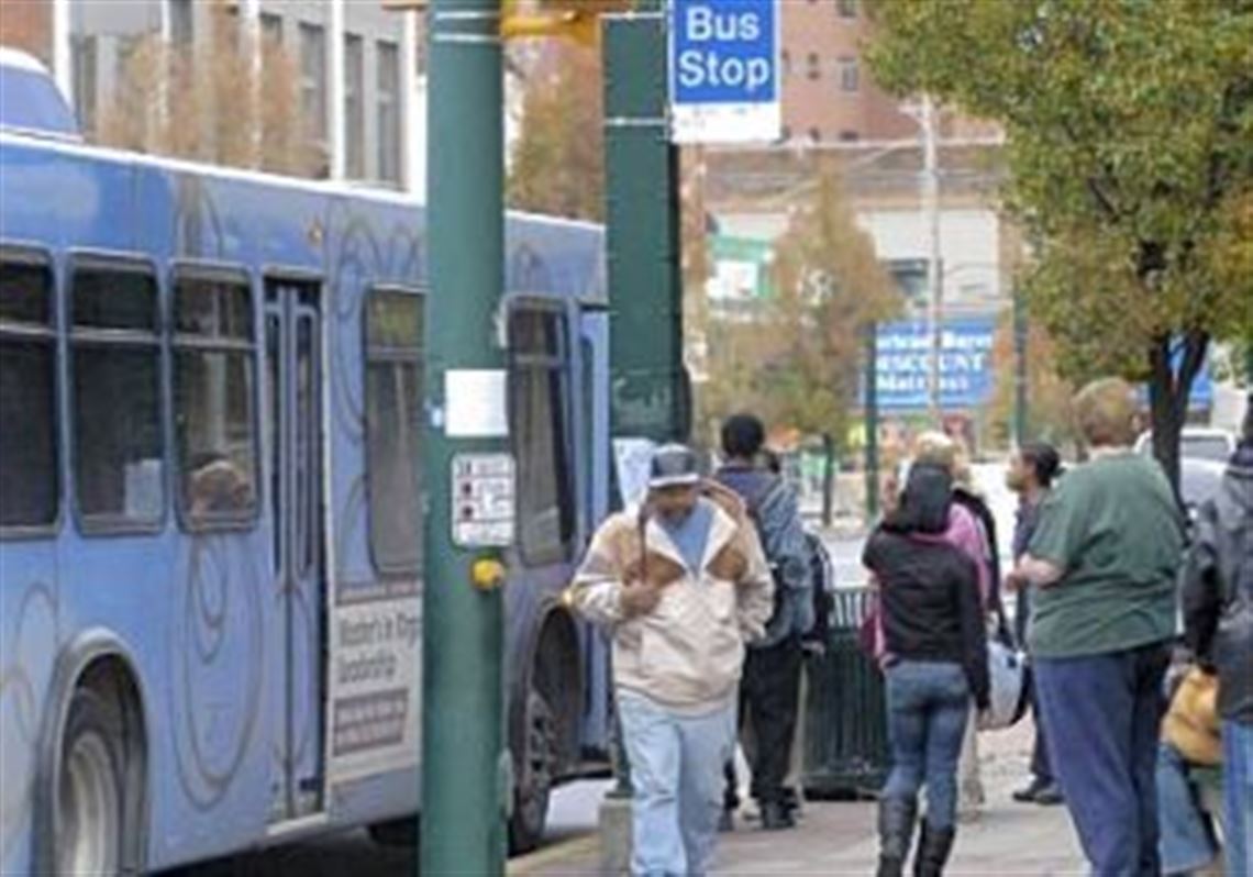 Riders board a PAT bus on East 8th Avenue in Homestead.
