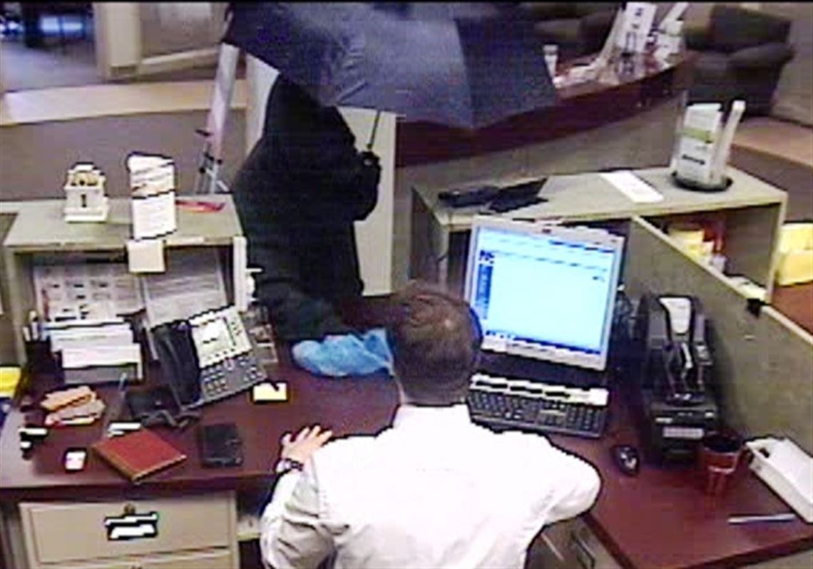 Umbrella-wielding, white-collar robber who hit six banks heads to prison