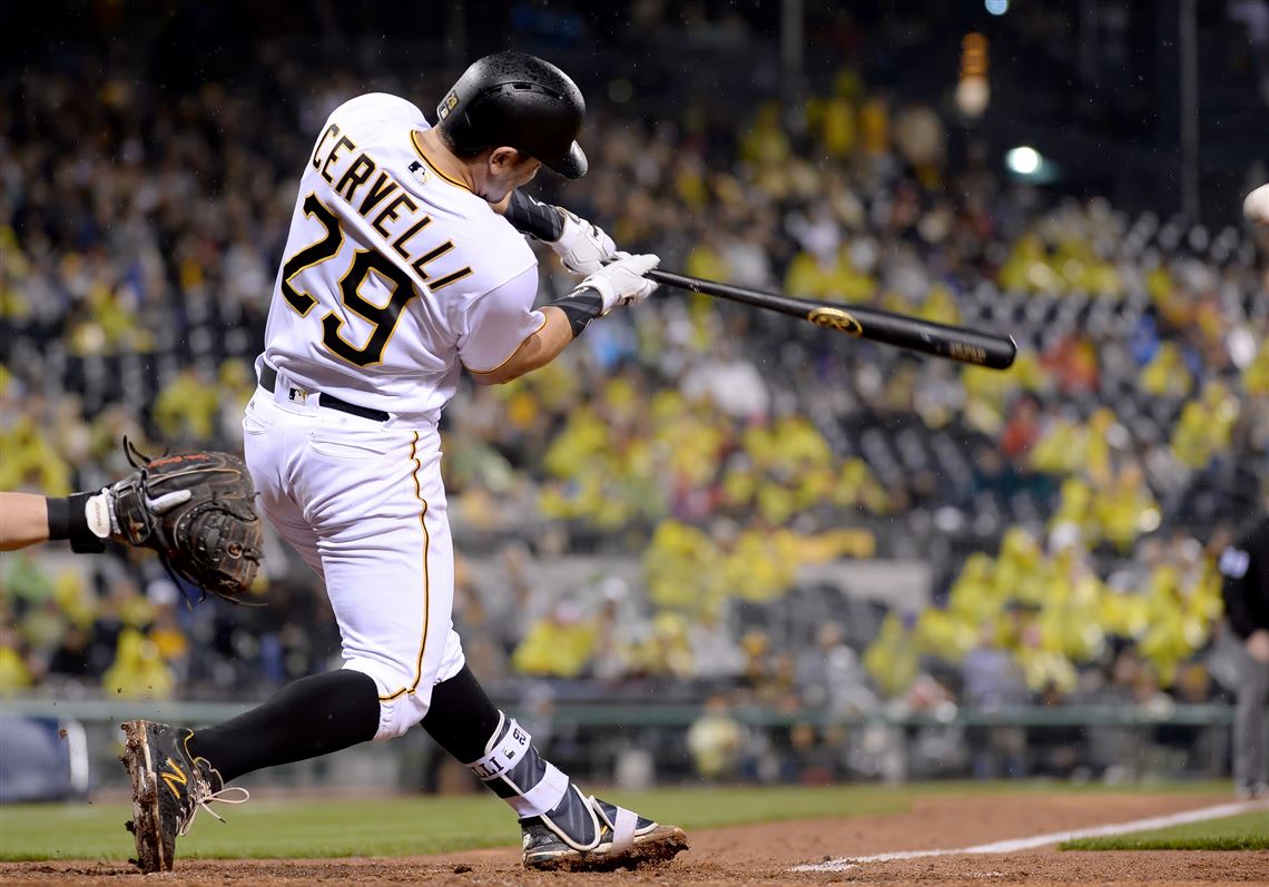  Pirates' Francisco Cervelli hits a single scoring David Freese in the fifth inning against the Reds Saturday night at PNC Park.
