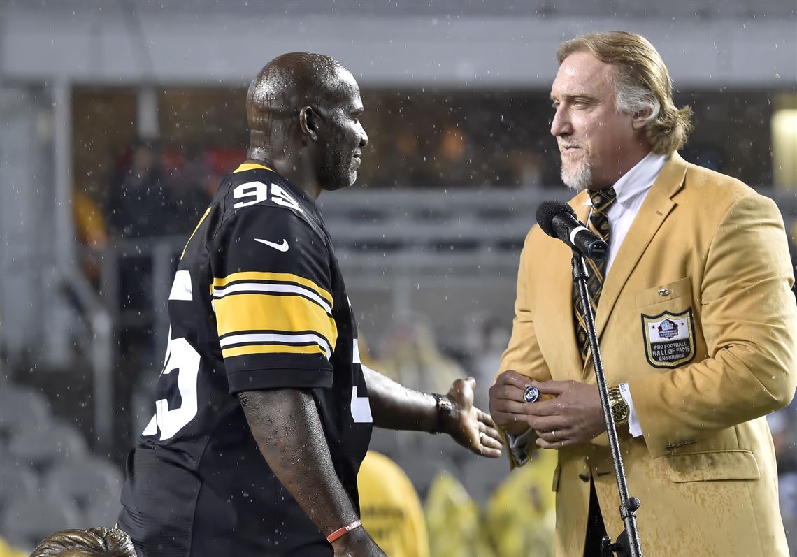 Pittsburgh Steelers Greg Lloyd sits on his helmet during the final