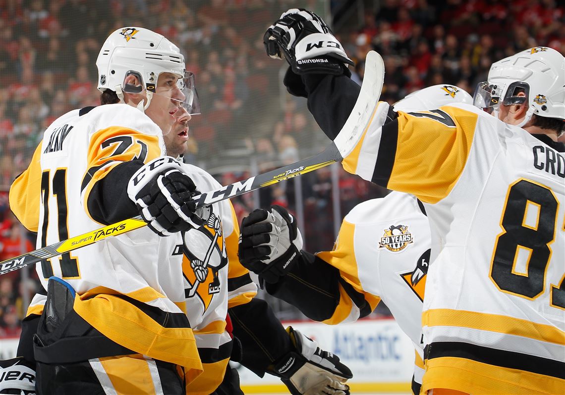 Evgeni Malkincelebrates his goal with Sidney Crosby in the first period Tuesday