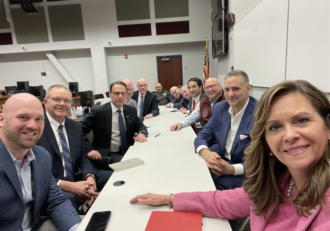 State Sen. Camera Bartolotta, front right, sits at a table with Gov. Josh Shapiro and other officials.