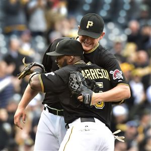 Pirates reliever Jared Hughes celebrates with Josh Harrison after beating the Cardinals 8-2 at PNC Park last September.