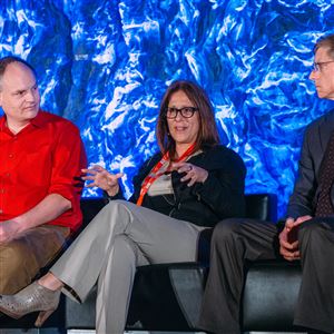 Andrew Moore, Dean of Computer Science at CMU left, and John Bares, Director, Uber ATC, right, listen to Audrey Russo, President and CEO, Pittsburgh Technology Council, during a panel discussion at the Intelligent Transportation Systems meeting in Pittsburgh.