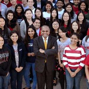 Subra Suresh, Carnegie Mellon University's president, stands among a group of international students on the school's campus in 2014.
