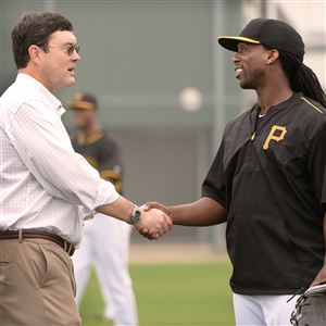 Pirates chairman Bob Nutting greets Andrew McCutchen during spring training in Bradenton in 2015.