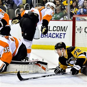 Patric Hornqvist slides in to the Flyers goal Wednesday night.